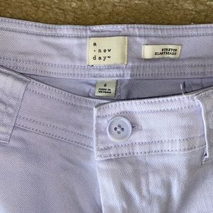 Light lavender colored jeans/pants.